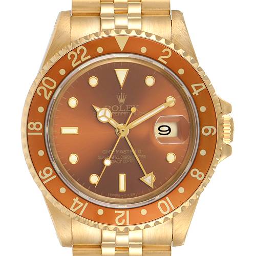 The image shows a front view of a Rolex GMT-Master 16718 Men's Yellow Gold Brown Dial 16718 Men's Yellow Gold Brown Dial watch, featuring the face, bezel, and part of the bracelet.