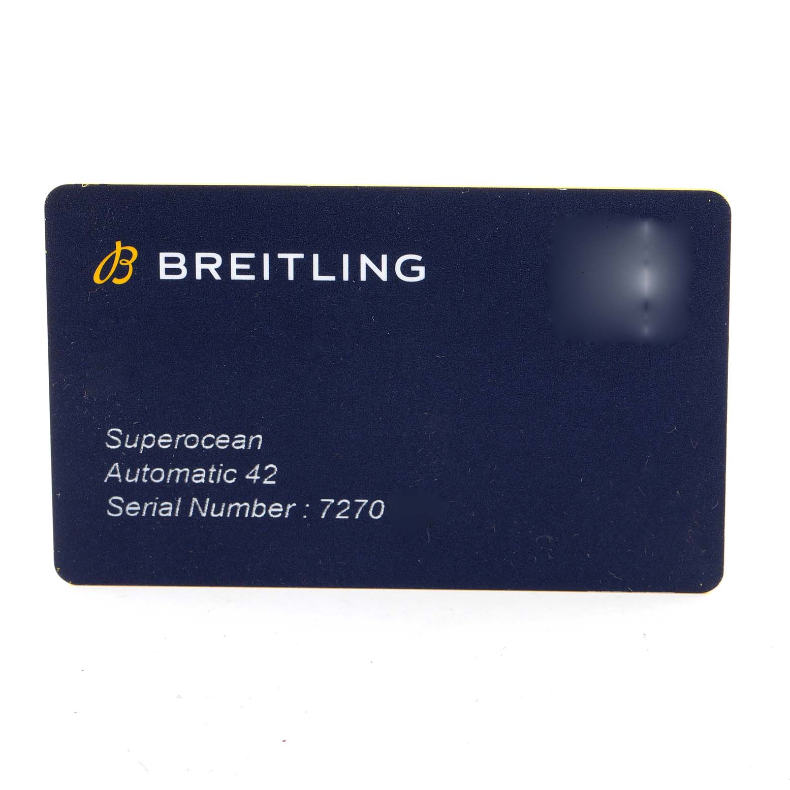 The image shows a Breitling Superocean A17366 Men's Stainless Steel White Dial A17366 Men's Stainless Steel White Dial Automatic 42 warranty card displaying the brand, model, and serial number.