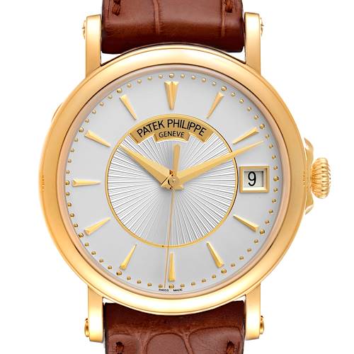 The image is a close-up front view of a Patek Philippe Calatrava 5153J Men's Yellow Gold Silver Dial 5153J Men's Yellow Gold Silver Dial watch, showing the dial, hands, markers, date window, and part of the leather strap.