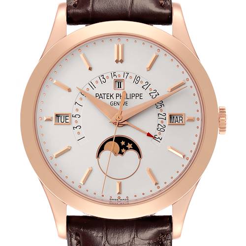 The Patek Philippe Complications 5496R-001 Men's Rose Gold Silver Dial 5496R-001 Men's Rose Gold Silver Dial watch is shown from a front angle, highlighting its dial, rose gold case, and leather strap.