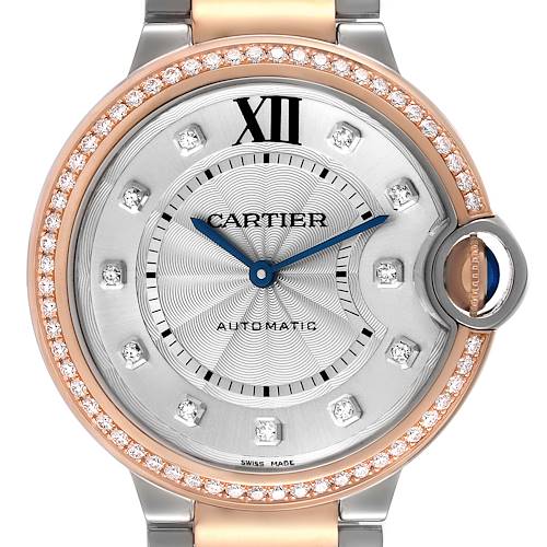 This image shows a close-up of the Cartier Ballon Bleu W3BB0004 Women's Steel and Gold (two tone) Silver Dial W3BB0004 Women's Steel and Gold (two tone) Silver Dial watch face and part of the band, highlighting the dial, bezel, and crown.