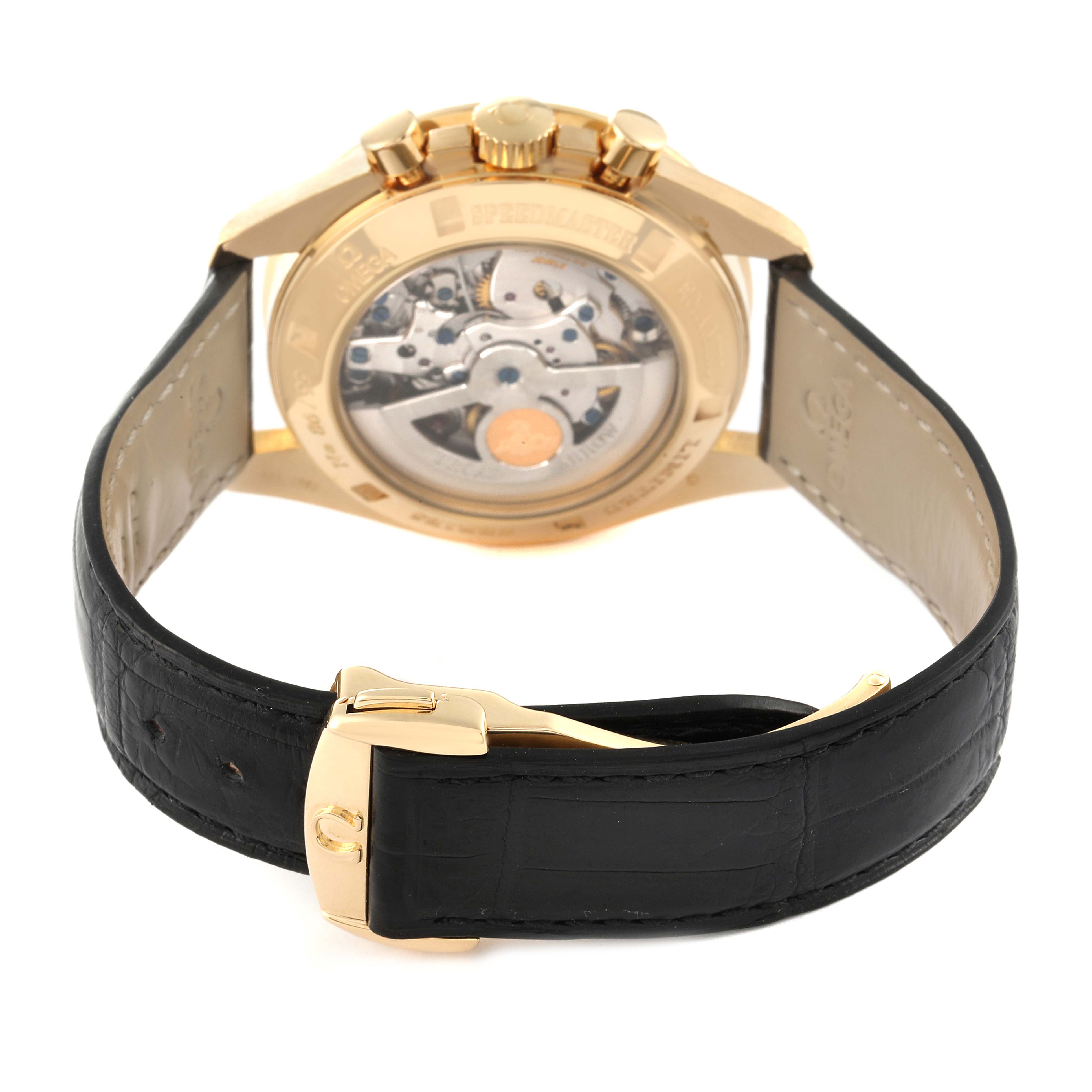 This image shows the back view of the Omega Speedmaster 3656.20.31 Men's Yellow Gold White Dial 3656.20.31 Men's Yellow Gold White Dial watch, highlighting the movement and leather strap with a gold buckle.