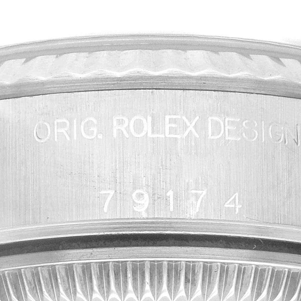 The image shows a close-up of the side engraving on a Rolex Datejust 79174G Women's Stainless Steel Blue Dial 79174G Women's Stainless Steel Blue Dial model, displaying "Orig. Rolex Design 79174".