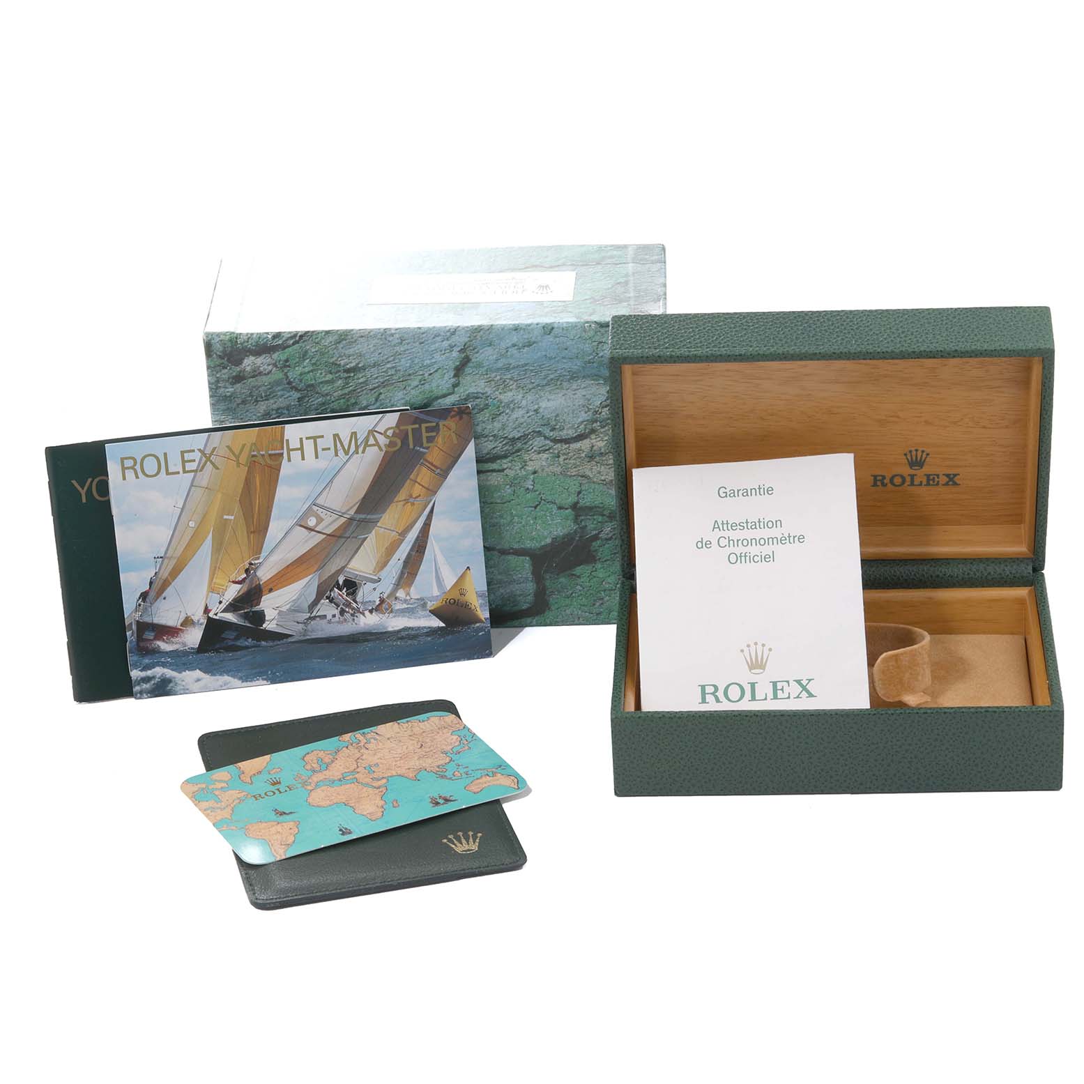 The image shows an open Rolex Yacht-Master 169622 Women's Stainless Steel Silver Dial 169622 Women's Stainless Steel Silver Dial box, a warranty card, a booklet, and a world map card holder.