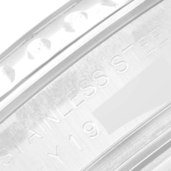 This close-up image shows part of the stainless steel bezel and case back of a Rolex Yacht-Master 169622 Women's Stainless Steel Silver Dial 169622 Women's Stainless Steel Silver Dial watch.