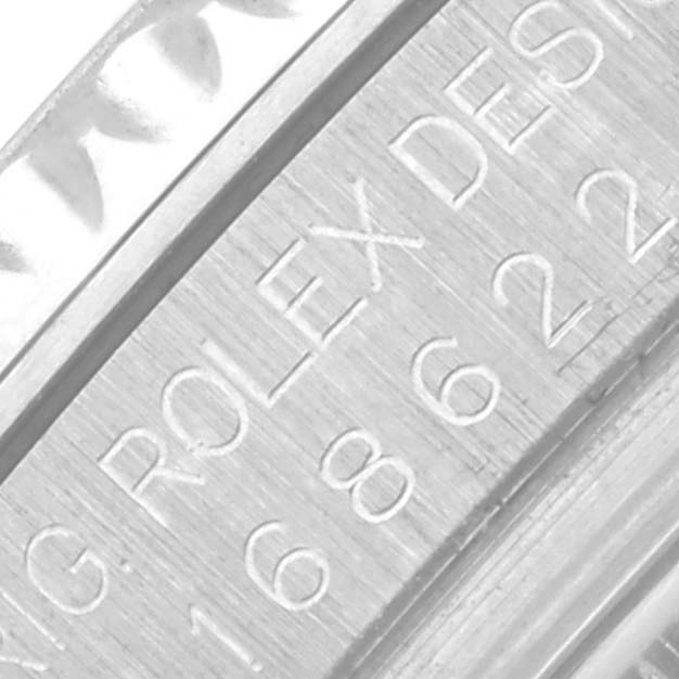 The image shows a close-up of the Rolex Yacht-Master 168622 Men's Stainless Steel Silver Dial 168622 Men's Stainless Steel Silver Dial watch engravings on the case edge.