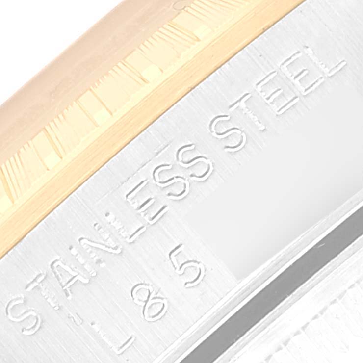 The image shows a close-up of the side engraving on the bezel of a Rolex Date 15223 Men's Steel and Gold (two tone) White Dial 15223 Men's Steel and Gold (two tone) White Dial model, highlighting "STAINLESS STEEL."