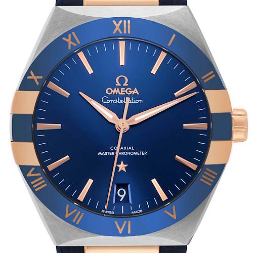 This is a close-up of the dial and bezel of an Omega Constellation 131.23.41.21.03.001 Men's Steel and Gold (two tone) Blue Dial 131.23.41.21.03.001 Men's Steel and Gold (two tone) Blue Dial watch, showcasing its face and crown.