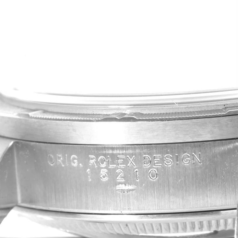 The image shows a close-up of the side case of a Rolex Date 15210 Men's Stainless Steel Silver Dial 15210 Men's Stainless Steel Silver Dial model with the engraved design number "15210."