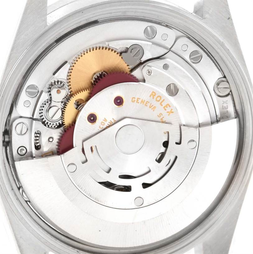 This image displays the intricate internal movement of a Rolex Date 15210 Men's Stainless Steel Silver Dial 15210 Men's Stainless Steel Silver Dial model watch from a rear angle.