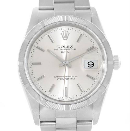 The image shows a front view of a Rolex Oyster Perpetual Date watch, highlighting the dial, markers, and date window.