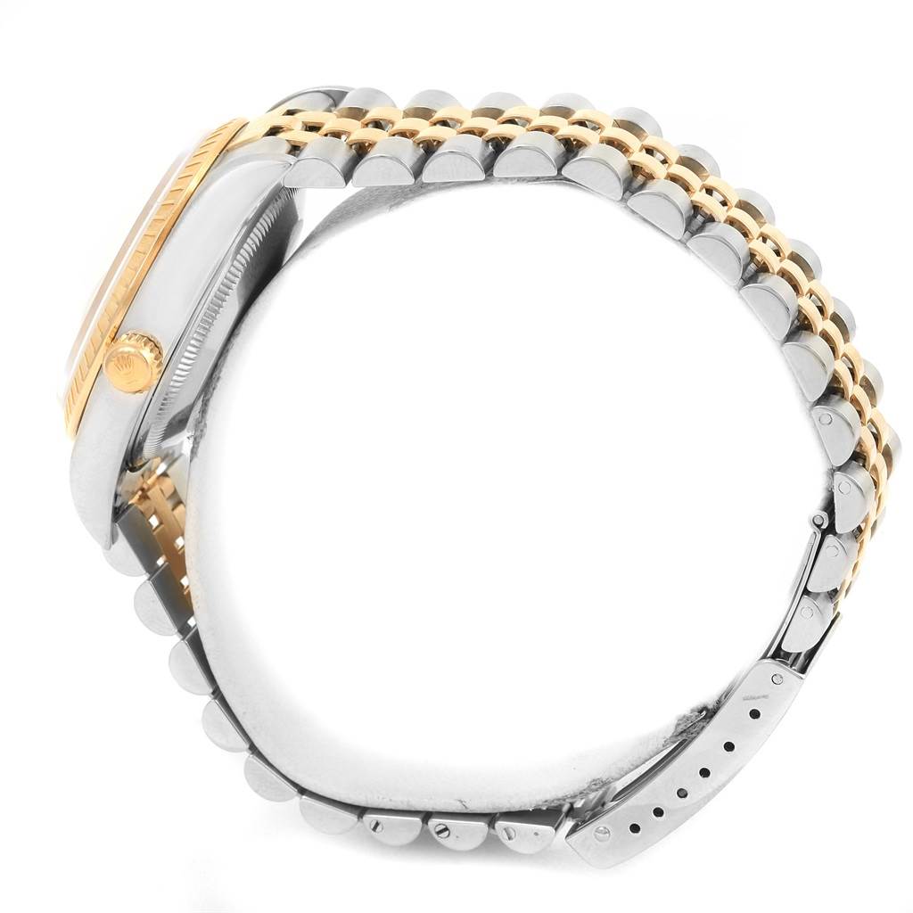 This image shows a side profile of a Rolex Date 15223 Men's Steel and Gold (two tone) White Dial 15223 Men's Steel and Gold (two tone) White Dial model, highlighting its crown, bezel, and two-tone bracelet.