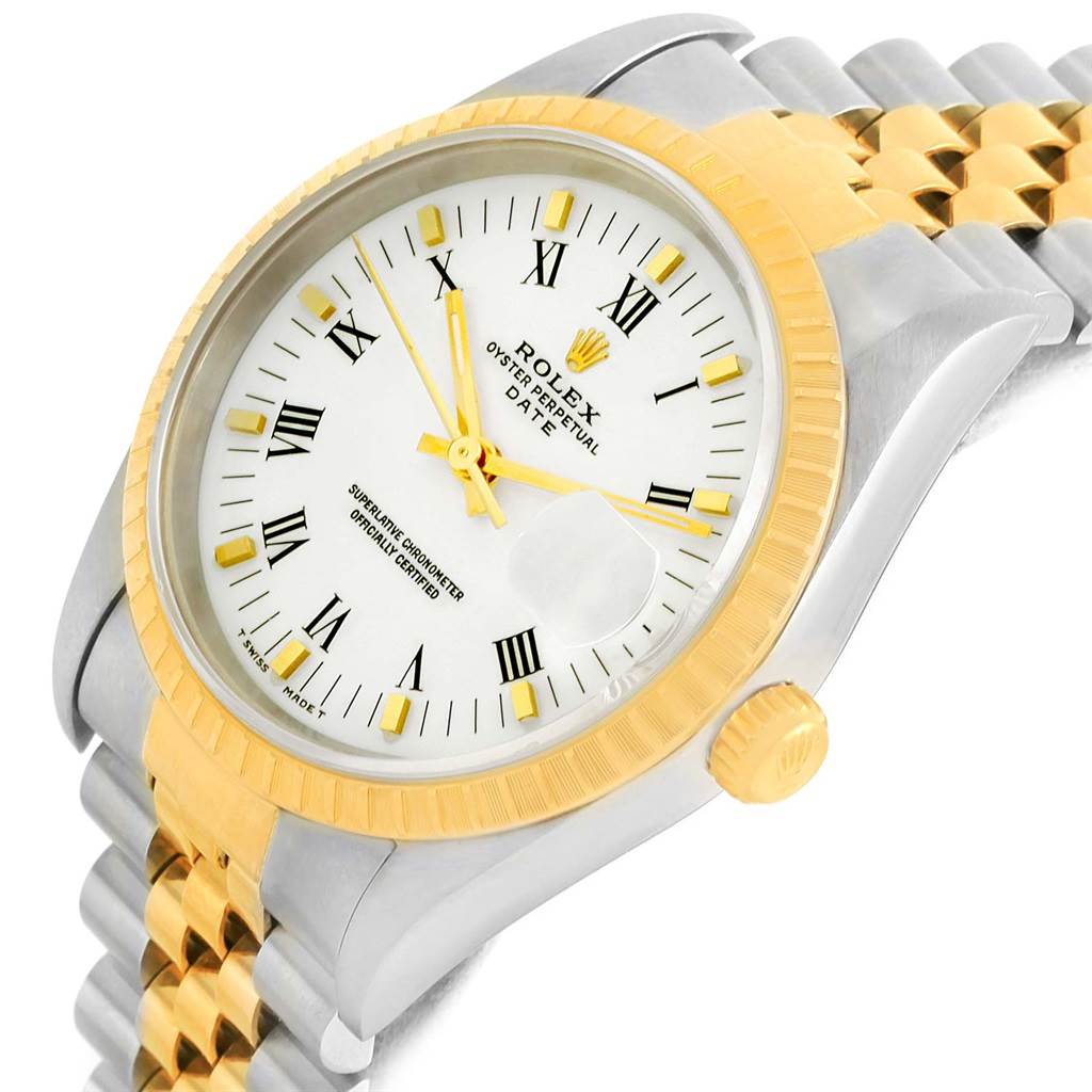 This image shows a Rolex Date 15223 Men's Steel and Gold (two tone) White Dial 15223 Men's Steel and Gold (two tone) White Dial watch at an angled close-up, highlighting its gold bezel, white dial, and two-tone bracelet.