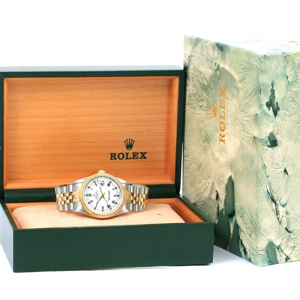 The Rolex Date 15223 Men's Steel and Gold (two tone) White Dial 15223 Men's Steel and Gold (two tone) White Dial model watch is shown inside its open box with the outer packaging also visible.