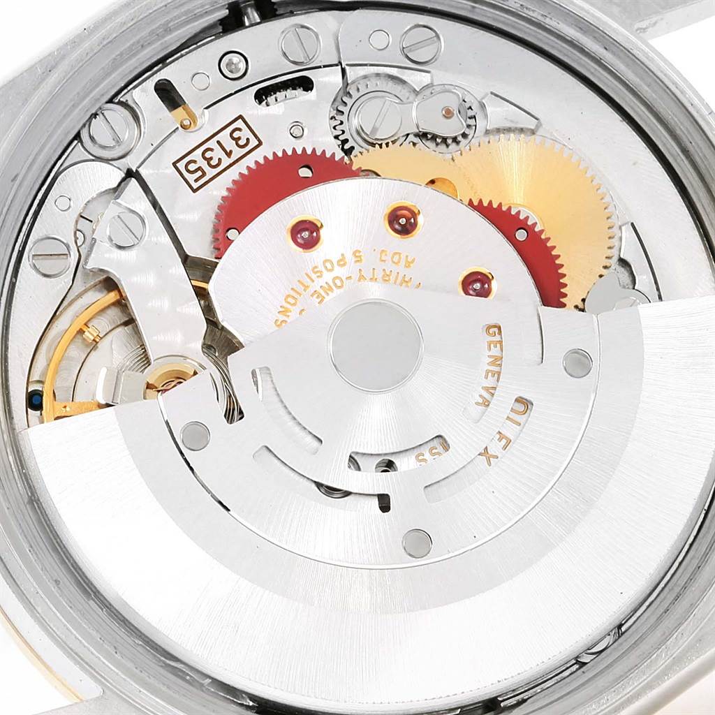 This image shows a close-up of the movement mechanism inside a Rolex Date 15203 Men's Steel and Gold (two tone) Black Dial 15203 Men's Steel and Gold (two tone) Black Dial model watch.