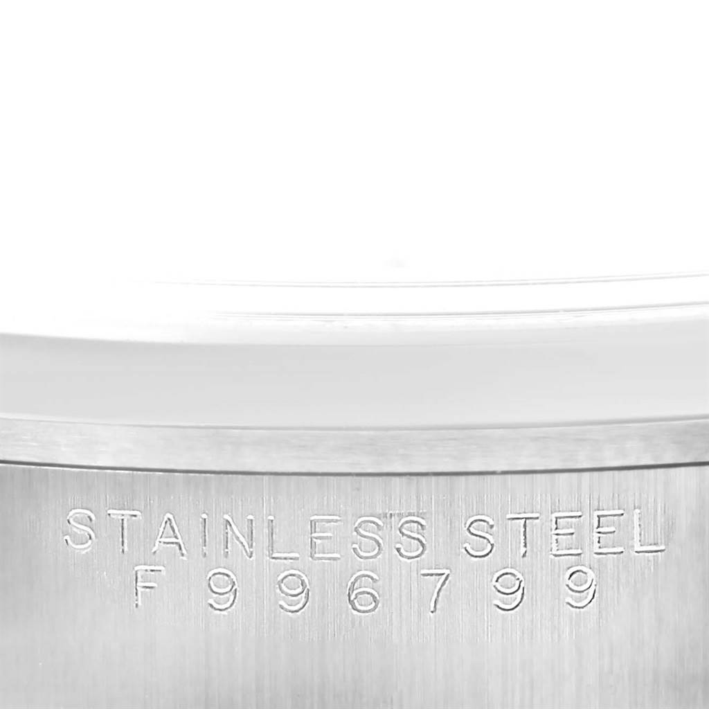 This image shows the side of the case of the Rolex Date 15200 Men's Stainless Steel Silver Dial 15200 Men's Stainless Steel Silver Dial model watch, highlighting the stainless steel material and serial number.