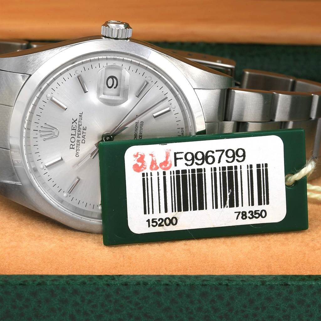 The image shows a close-up of the Rolex Date 15200 Men's Stainless Steel Silver Dial 15200 Men's Stainless Steel Silver Dial watch face, bezel, bracelet, and part of the crown with a tag showing its model number.