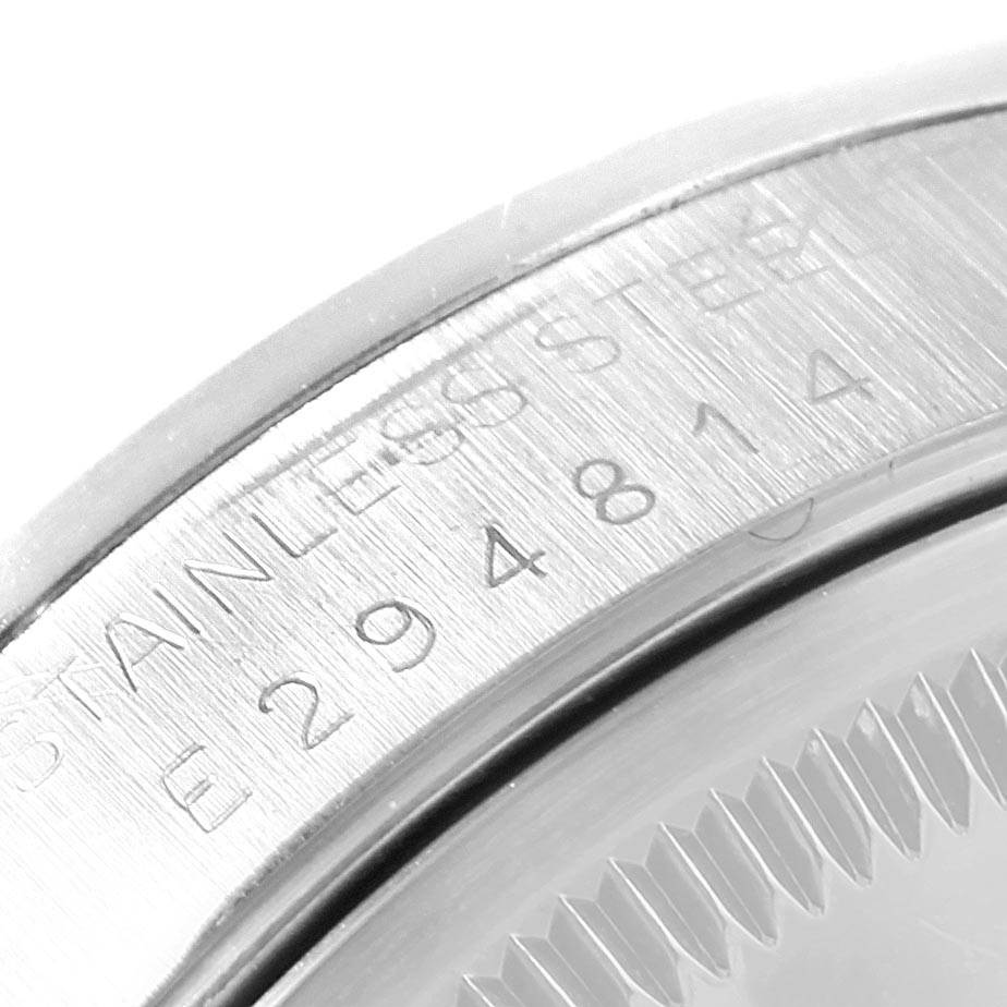 This close-up image shows the engraved serial numbers on the case back of a Rolex Date 15200 Men's Stainless Steel Silver Dial 15200 Men's Stainless Steel Silver Dial model watch.