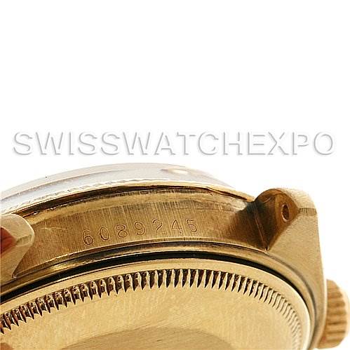 The image shows a close-up of the side of a Rolex Date 1503 Men's Yellow Gold Champagne Dial 1503 Men's Yellow Gold Champagne Dial model watch, highlighting part of the case and the serial number.