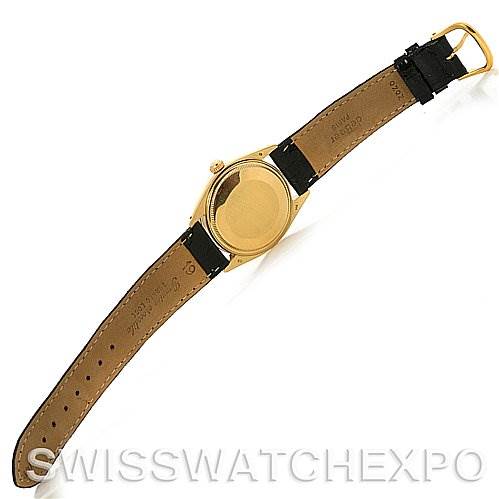 The image shows the back and strap of a Rolex Date 1503 Men's Yellow Gold Champagne Dial 1503 Men's Yellow Gold Champagne Dial model watch, angled to display the gold case and black leather strap.