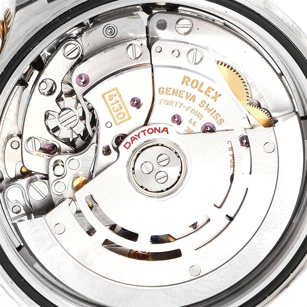 Close-up of the movement and internal mechanics of the Rolex Daytona 116523 Men's Steel and Gold (two tone) Black Dial 116523 Men's Steel and Gold (two tone) Black Dial watch, showing gears, rotors, and engravings.