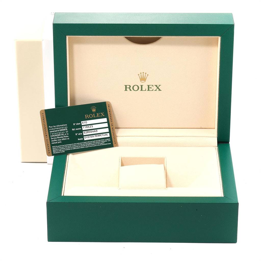 This image shows an open Rolex Daytona 116523 Men's Steel and Gold (two tone) Black Dial 116523 Men's Steel and Gold (two tone) Black Dial watch box with a Rolex certification card displayed next to it.