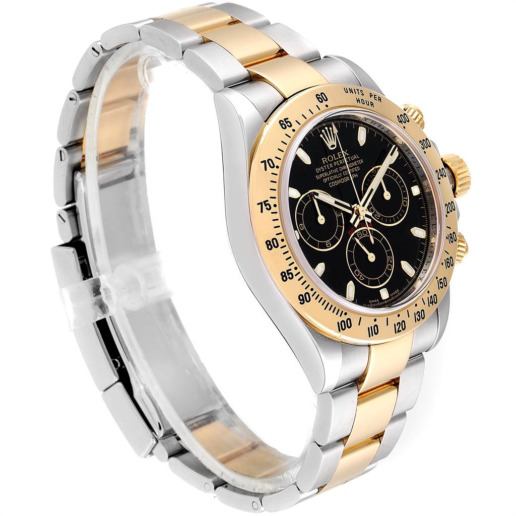 The image shows a side and partial front view of a Rolex Daytona 116523 Men's Steel and Gold (two tone) Black Dial 116523 Men's Steel and Gold (two tone) Black Dial watch, featuring a black dial and two-tone metal bracelet.