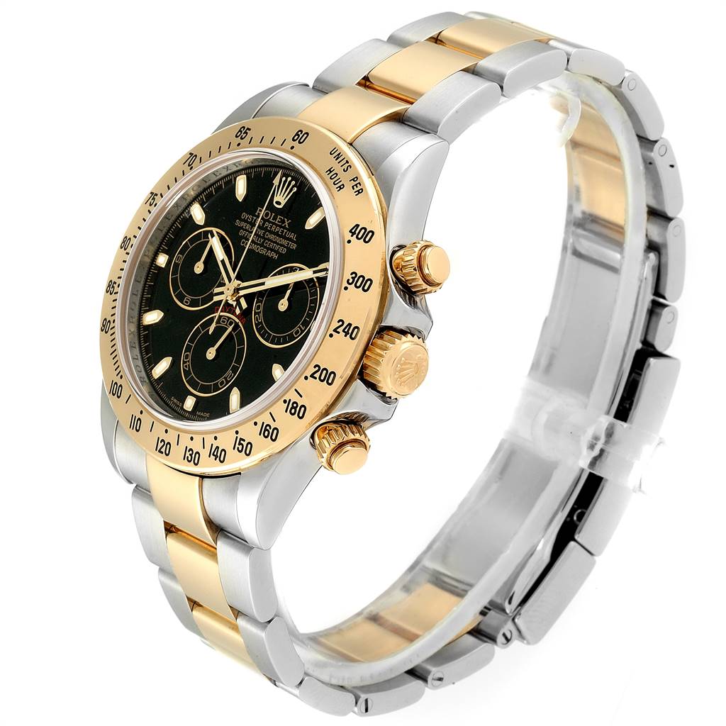 The Rolex Daytona 116523 Men's Steel and Gold (two tone) Black Dial 116523 Men's Steel and Gold (two tone) Black Dial watch is shown at an angle displaying its dial, bezel, crown, chronograph pushers, and parts of the bracelet.