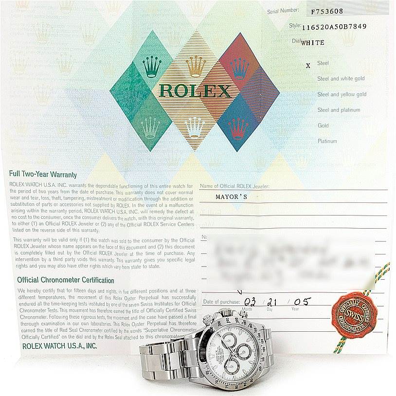 The image shows a Rolex Daytona 116520 Men's Stainless Steel White Dial 116520 Men's Stainless Steel White Dial watch, photographed from the front, placed on its warranty document.