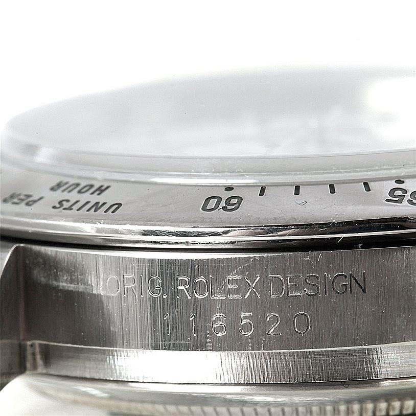 This image shows a close-up of the bezel and case side of a Rolex Daytona 116520 Men's Stainless Steel White Dial 116520 Men's Stainless Steel White Dial watch with the model number 116520.