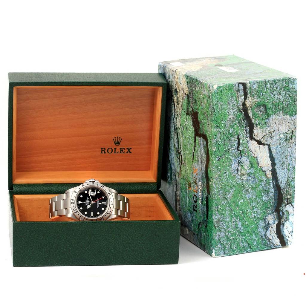 The Rolex Explorer 16570 Men's Stainless Steel Black Dial 16570 Men's Stainless Steel Black Dial watch is displayed in its open green box with the outer packaging beside it.