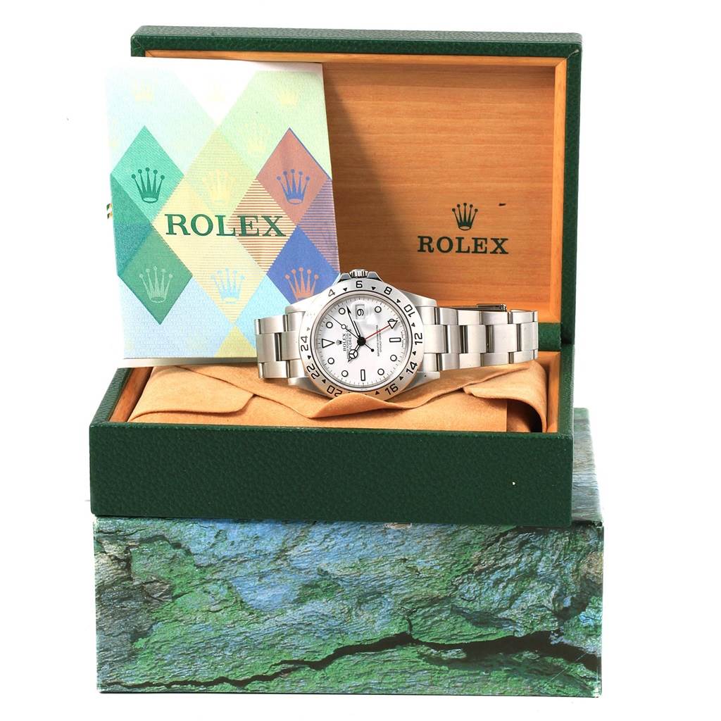 The image shows a Rolex Explorer 16570 Men's Stainless Steel White Dial 16570 Men's Stainless Steel White Dial watch in its box, along with a booklet, viewed from the front.