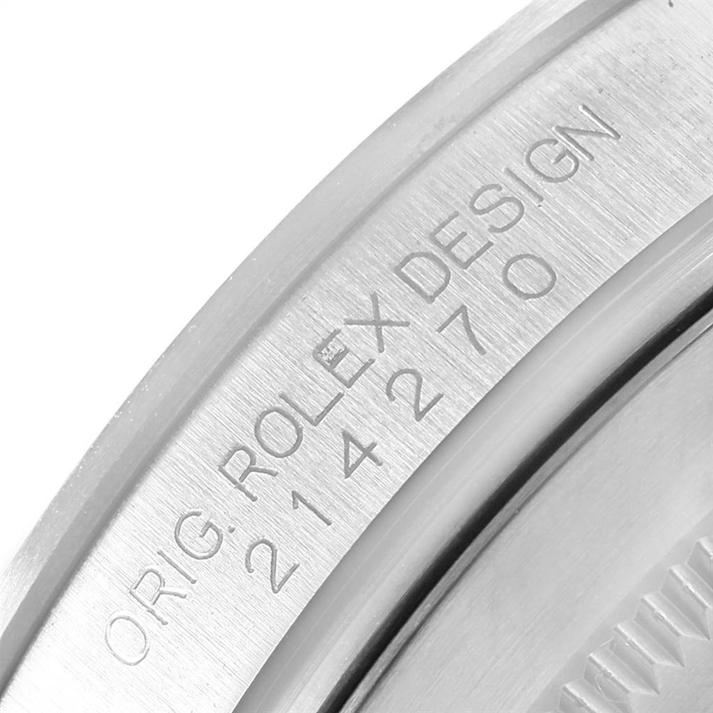 This image shows a close-up view of the engraved text on the case back of a Rolex Explorer 214270 Men's Stainless Steel Black Dial 214270 Men's Stainless Steel Black Dial watch.