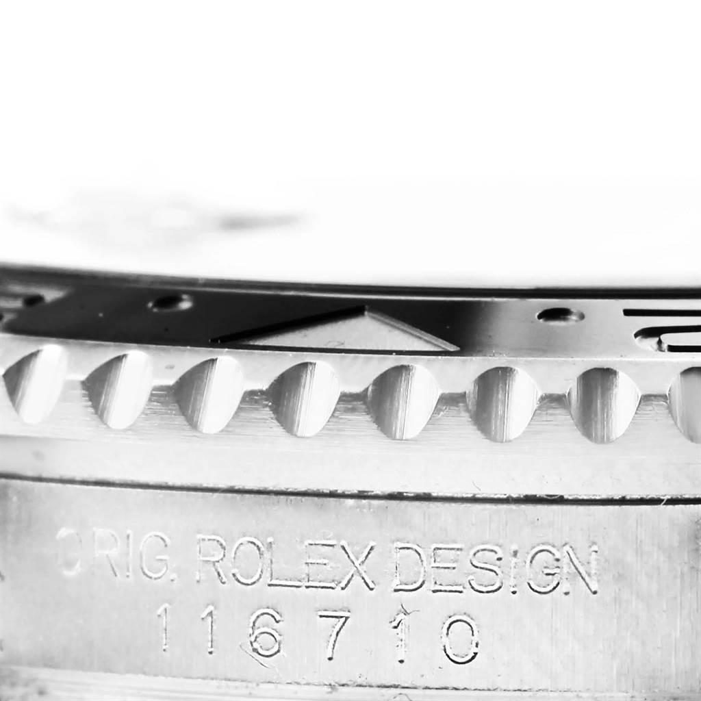 This image shows a close-up of the bezel and case side engraving of the Rolex GMT-Master 116710 Men's Stainless Steel Black Dial 116710 Men's Stainless Steel Black Dial watch.