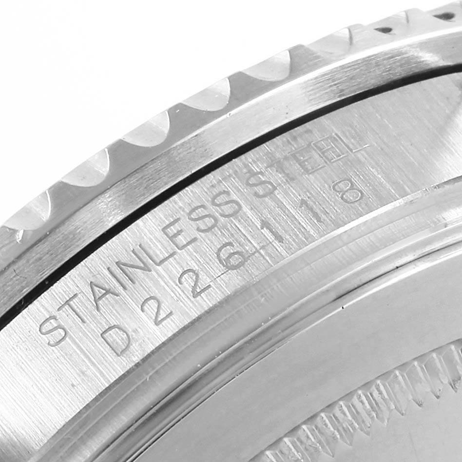 This image shows a close-up of the case back edge and part of the bezel of a Rolex GMT-Master 16710 Men's Stainless Steel Black Dial 16710 Men's Stainless Steel Black Dial, highlighting the stainless steel engraving.