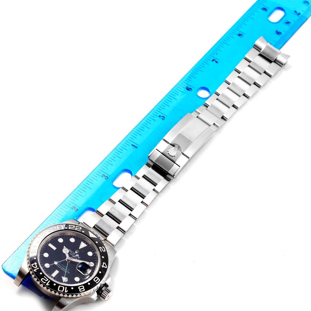 The image shows a Rolex GMT-Master 116710 Men's Stainless Steel Black Dial 116710 Men's Stainless Steel Black Dial watch laid flat with its stainless steel bracelet extended and aligned with a ruler.