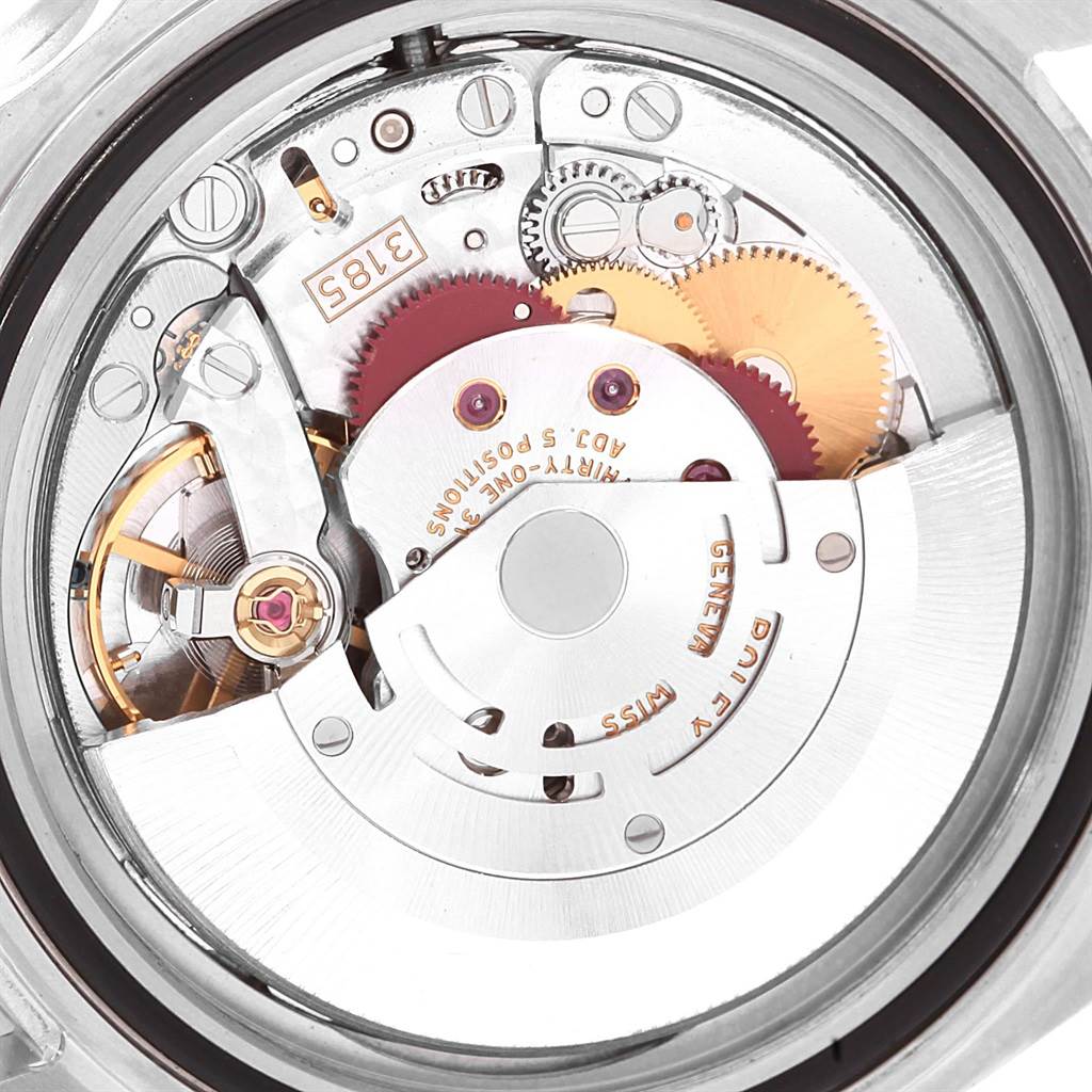 This image shows the internal movement of the Rolex GMT-Master 16710 Men's Stainless Steel Black Dial 16710 Men's Stainless Steel Black Dial watch, primarily focusing on its gears and mechanisms from a top-down angle.