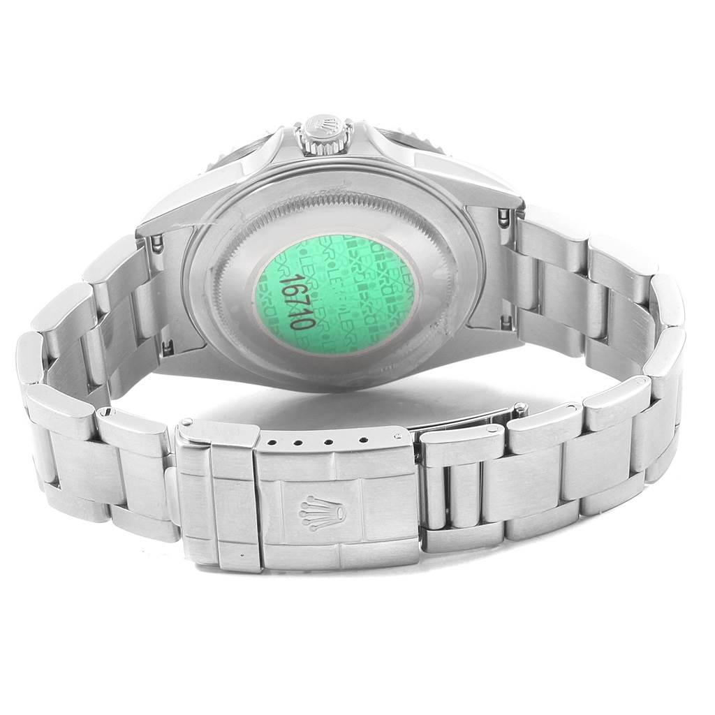 The image shows the back view of a Rolex GMT-Master 16710 Men's Stainless Steel Black Dial 16710 Men's Stainless Steel Black Dial watch, highlighting the case back, crown, and bracelet with the clasp.