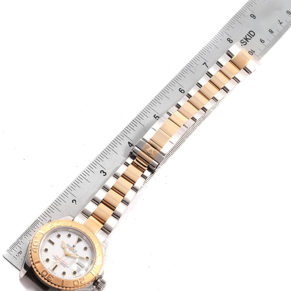 The Rolex Yacht-Master 16623 Men's Stainless Steel White Dial 16623 Men's Stainless Steel White Dial watch is shown from a top-down angle, featuring the face, bezel, and part of the bracelet, measured with a ruler.