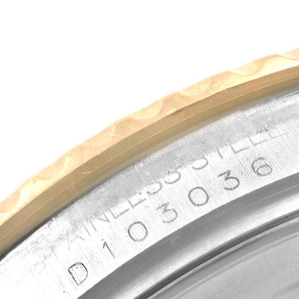 This close-up image shows the bezel and part of the case back of a Rolex Yacht-Master 16623 Men's Stainless Steel White Dial 16623 Men's Stainless Steel White Dial watch, highlighting the serial number and stainless steel inscription.