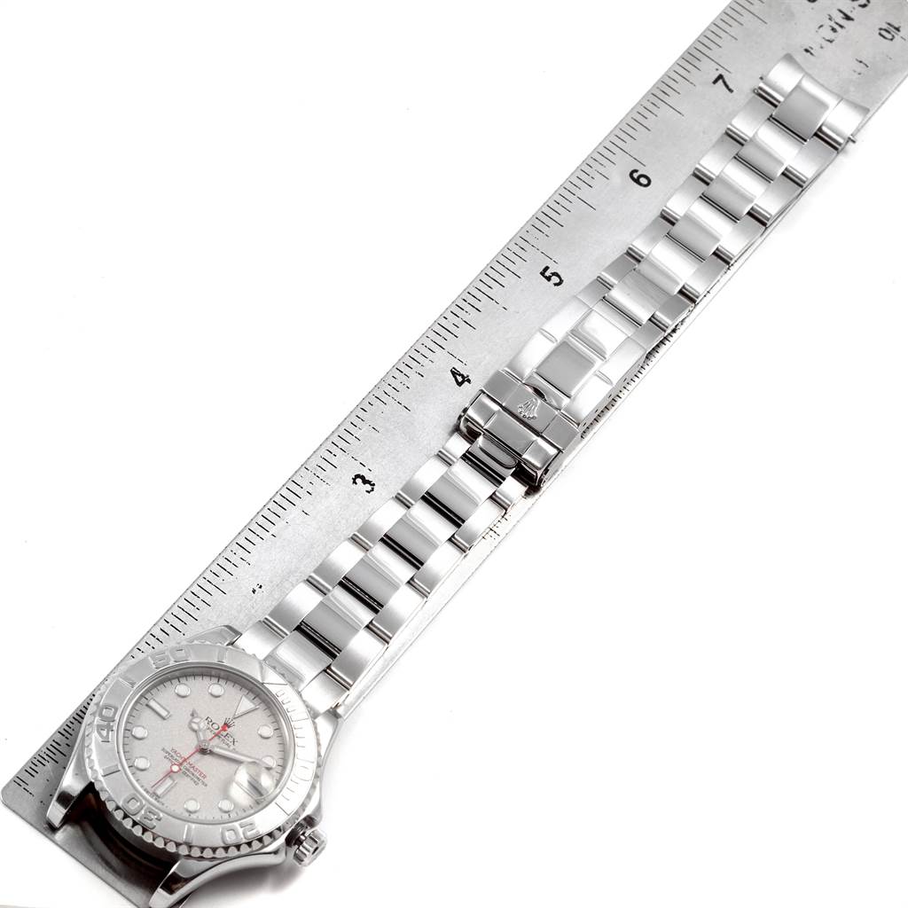 The image shows a top-down view of the Rolex Yacht-Master 168622 Men's Stainless Steel Silver Dial 168622 Men's Stainless Steel Silver Dial watch, including the face, bezel, and bracelet placed against a ruler for scale.