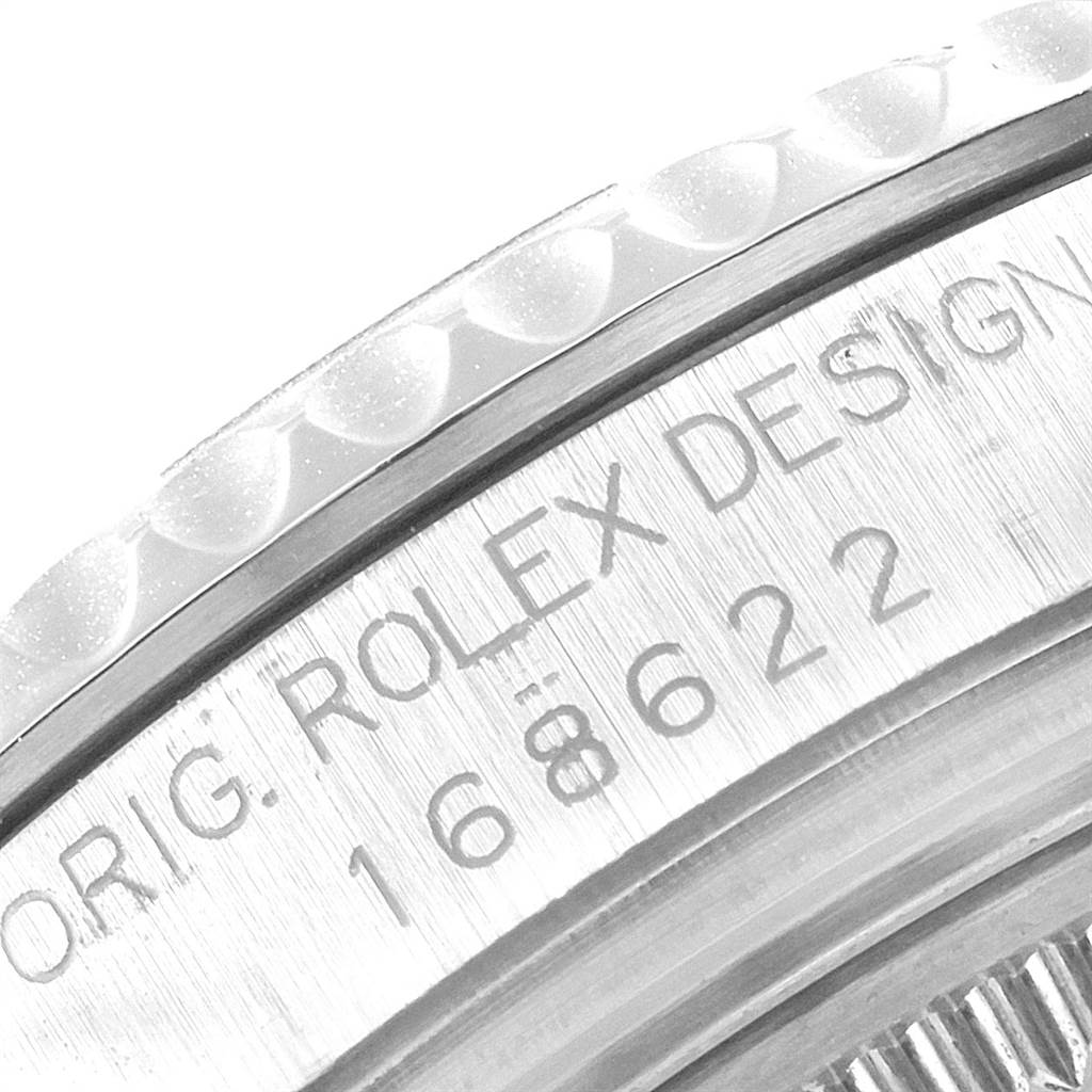 This close-up image shows the engraved bezel and part of the case of the Rolex Yacht-Master 168622 Men's Stainless Steel Silver Dial 168622 Men's Stainless Steel Silver Dial watch.