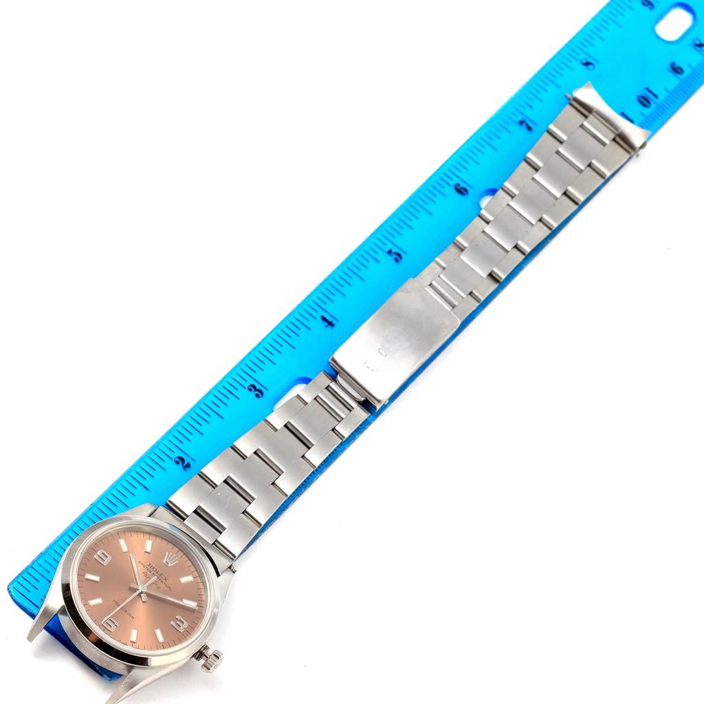 The image shows a Rolex Air-King 14000 Men's Stainless Steel Pink Dial 14000 Men's Stainless Steel Pink Dial watch laid flat next to a ruler, displaying its face, bracelet, and clasp.