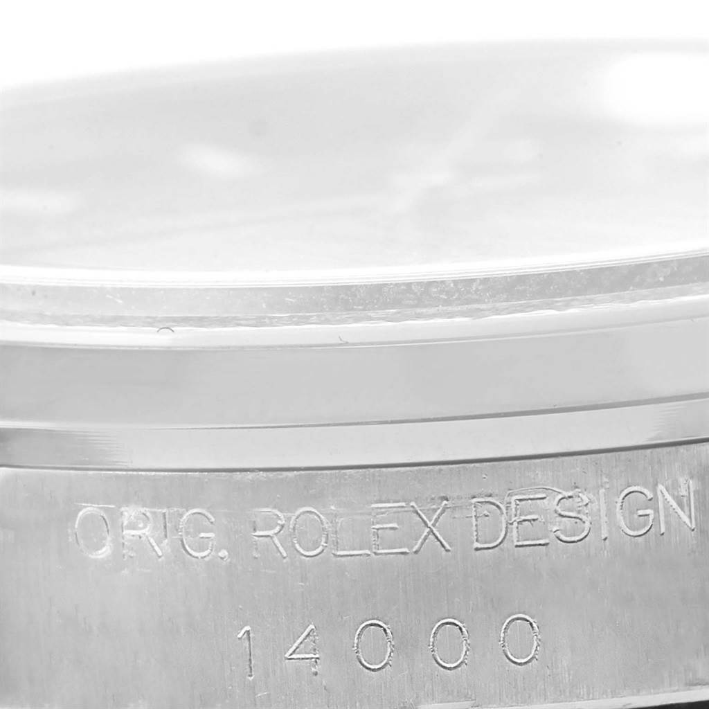 The image shows a close-up of the side of a Rolex Air-King 14000 Men's Stainless Steel Pink Dial 14000 Men's Stainless Steel Pink Dial watch, highlighting the engraving "ORIG. ROLEX DESIGN" and the model number "14000".