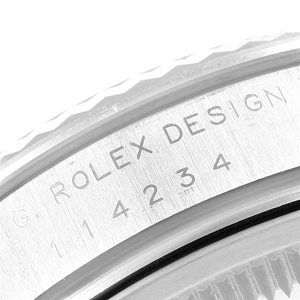 This image shows a close-up of the serial and model number engraving on a Rolex Air-King 114234 Men's Stainless Steel Silver Dial 114234 Men's Stainless Steel Silver Dial watch case.
