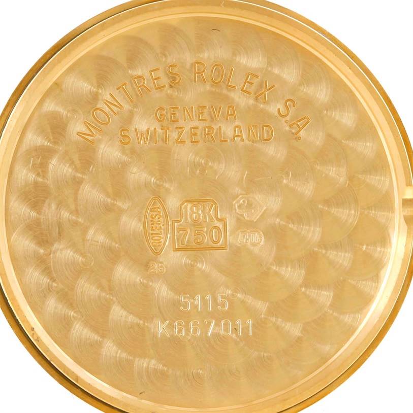 This is a close-up image of the inside case back of a Rolex Cellini 5115 Men's Yellow Gold Beige Dial 5115 Men's Yellow Gold Beige Dial watch, revealing details like the model number and 18K gold marking.