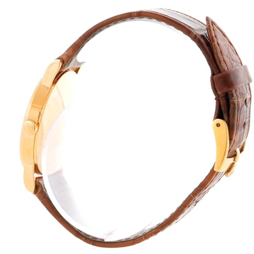 The image shows a side view of a Rolex Cellini 5115 Men's Yellow Gold Beige Dial 5115 Men's Yellow Gold Beige Dial watch with a brown leather strap and gold case.