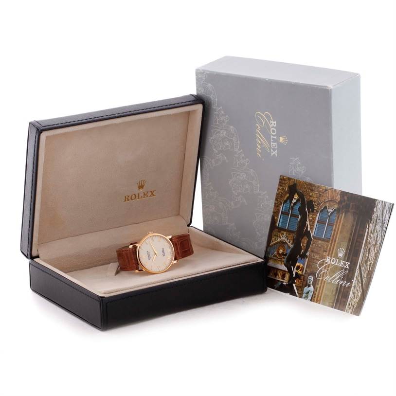 The image shows a Rolex Cellini 5115 Men's Yellow Gold Beige Dial 5115 Men's Yellow Gold Beige Dial watch inside an open box, along with an outer box and a booklet.