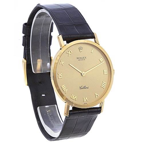 The image shows a side angle view of a Rolex Cellini 4112 Yellow Gold Champagne Dial 4112 Yellow Gold Champagne Dial watch, highlighting its gold case, Roman numeral dial, and black leather strap.