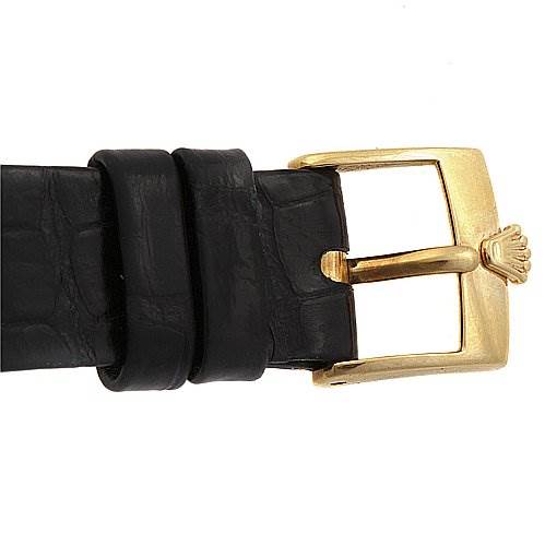 The image shows the black leather strap and gold buckle of a Rolex Cellini 4112 Yellow Gold Champagne Dial 4112 Yellow Gold Champagne Dial watch.